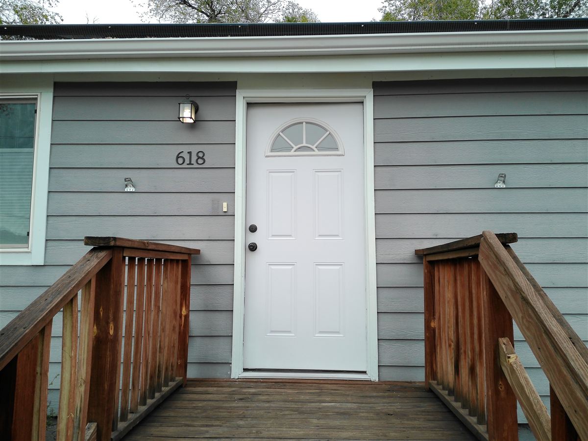 Front entry with wood steps and railings