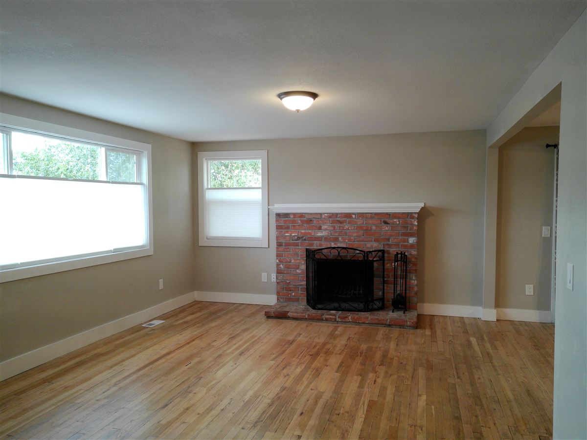 Living room with brick wood-burning fireplace
