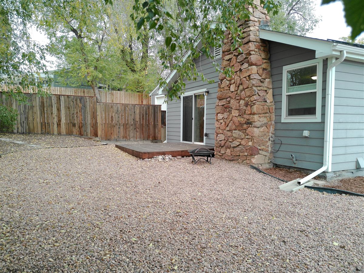 Backyard and stone chimney