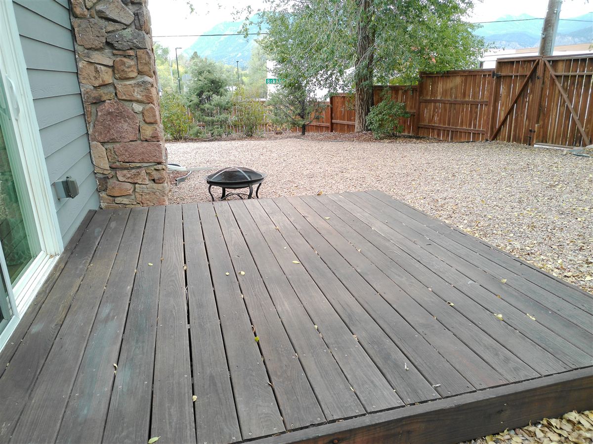 Deck and backyard with fire pit